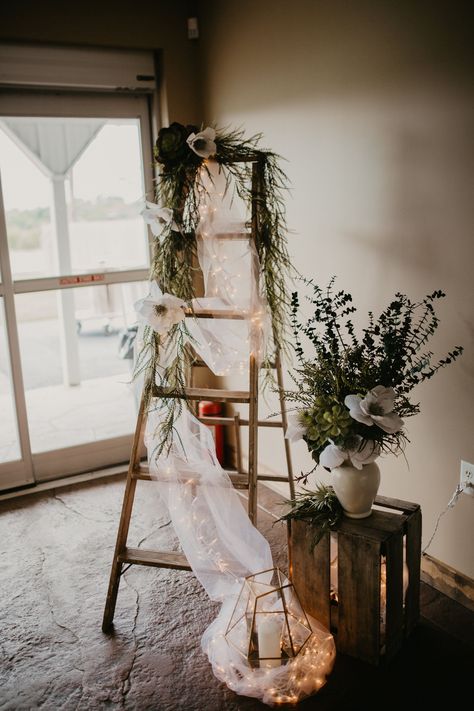 ladder wedding reception decor Venue: The Outpost Center | Photography: MV Photos Ladder At Wedding, Ladder Decorations For Wedding, Ladder Arch Wedding, Wooden Ladder Photo Shoot, Rustic Ladder Decor Wedding, Ladder For Wedding Decor, Wedding Ladders Decoration, Old Ladder Wedding Decor, Wooden Ladder Wedding Decor