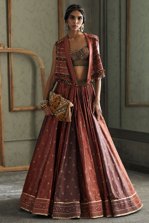 Featuring a multi colored lehenga in brocade base with meenakari, gota, aari and sequins embroidery. It is paired with a matching blouse and a gilet jacket.  FIT: Fitted at bust and waist. COMPOSITION: Brocade. CARE: Dry clean only. Tarun Tahiliani Lehenga 2023, Latest Designer Chaniya Choli, Aza Fashion Outfits 2023 Lehenga, Banarasi Lehenga Sabyasachi, Banarasi Lengha, Koti Blouse, Rajasthani Embroidery, Tarun Tahiliani Lehenga, Tarun Tahiliani Bridal