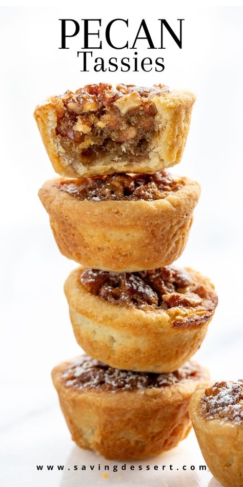 Pecan Tassies are like a mini pecan pie (but not as sweet) made with a cream cheese tart shell. They're buttery, lightly sweet, nutty and oh-so easy to pop right in your mouth! These mini pies are really great for gifting during the holidays. They freeze well and travel great. All you need is a mini-muffin tin and a mixer. #pecantassies #pecanpies #minipecanpies #pecandessert #holidaycookie #pecantassierecipe Pecans Mini Pies, Giftable Baked Goods, Gluten Free Mini Pecan Pies, Mini Pecan Desserts, Pecan Pies In A Muffin Tin, Easy Buffet Desserts, Mini Pecan Phyllo Tarts, Pecan Pie Tassies Recipe, Nut Cups Recipe Pecans