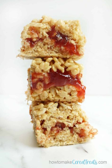 The BEST Peanut Butter and Jelly Rice Krispie Treats -- no bake! Making Rice Crispy Treats, Rice Krispie Treats Variations, Rice Krispie Treats Cereal, Cereal Treat Recipes, Fun Rice Krispie Treats, Peanut Butter Rice Crispies, Peanut Butter Rice Krispie Treats, Rice Crispy Treats Recipe, Rice Cereal Treats