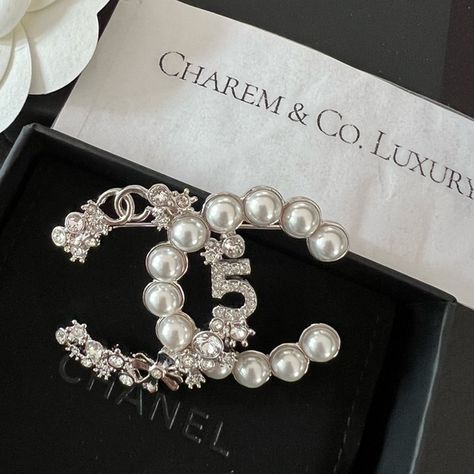 Shop charemcoluxury's closet or find the perfect look from millions of stylists. Fast shipping and buyer protection. NWT! ✨ RARE! Hard to come by! Super Beautiful CHANEL 23P CC Logo Signature silver Crystal Pearl Brooch. This is the statement piece that will make you stand out on any outfit ✅ Brand New boutique fresh Condition ✅Comes with full set w/Tag, & RECEIPT (sensitive info omitted) ✅ Listed Price is FIRM! No offer will be accepted. Poshmark will authenticate Chanel Brooch Outfit, Chanel Jewellery, Chanel Lover, Ombre Prom Dresses, Classic Chanel, Chanel Brooch, Chanel Box, Chanel Brand, Chanel Inspired