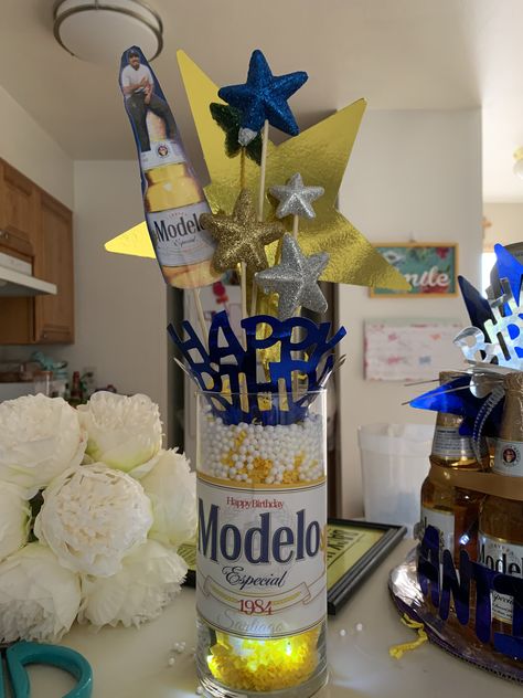 Modelo theme birthday centerpieces Modelo Beer Centerpieces, Modelo Centerpieces Birthday Parties, Modelo Centerpieces, Modelo Themed Birthday Party, Modelo Party Theme, Modelo Beer Theme Party, Beer Centerpieces For Men, Buchonas Party, Beer Centerpieces