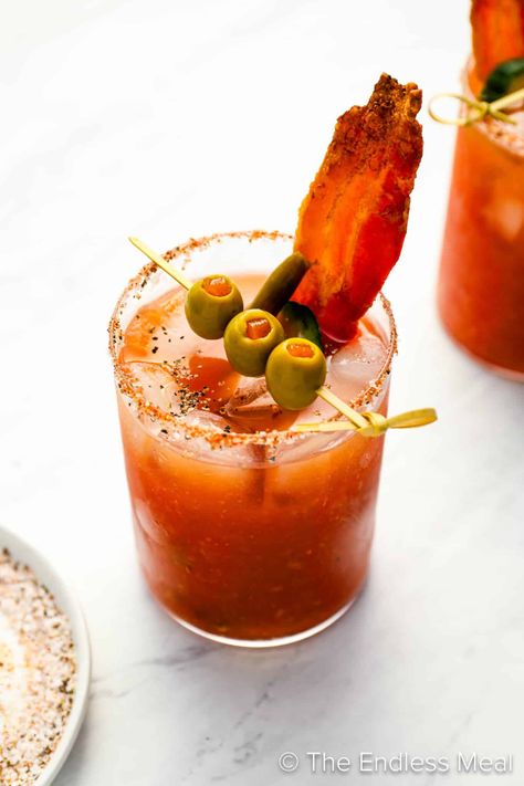 PIN TO SAVE FOR LATER! A Bloody Caesar is a classic Canadian cocktail. It is similar to a Bloody Mary but has a lot more depth of flavor. We make our own homemade Clamato juice (it's easy!) for the best flavor. Want to know how to make the best Caesar drink? We'll show you how! #theendlessmeal #bloodycaesar #bloodymary #caesar #ceasar #caesarcocktail #caesardrink #caesarrecipe #bloodymaryrecipe #clamato #homemadeclamato #clamatojuice #brunch #brunchcocktails #brunchdrinks #breakfast #cocktails Caesar Drink, Caesar Cocktail, Caesar Recipe, Breakfast Cocktails, Drink Garnishing, Brunch Drinks, Pork Sliders, Southern Fried Chicken, Brunch Cocktails