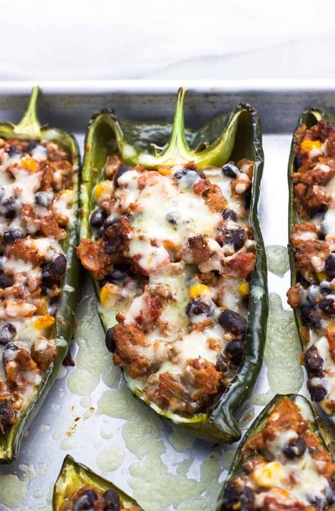 This healthy stuffed poblano peppers recipe is packed with turkey, black beans, and southwestern flavors for a satisfying, not-too-spicy main dish. Leftovers make a great lunch! Stuffed Poblano Peppers Healthy, Poblano Recipes Healthy, Black Bean Stuffed Poblano Peppers, Turkey Stuffed Poblano Peppers, Recipes For Poblano Peppers, Stuffed Poblano Peppers Vegetarian, Poblano Pepper Recipes Healthy, Poblano Recipes, Pepper Recipes Healthy