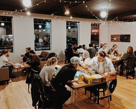 Board Game Coffee Shop, Board Game Cafe Aesthetic, Restaurant With Games, Coffee Games Ideas, Board Game Cafe Design, Board Game Night Aesthetic, Game Night Aesthetic, Board Game Bar, Board Game Store