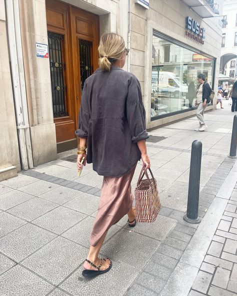 Santanderinians in Santander | ALL ABOUT SHIRT • Charcoal raglan sleeves shirt, bronze midi silk skirt, studded flat sandals, structured raffia bag and numerous bangles.... | Instagram Midi Silk Skirt, Studded Flats, Raffia Bag, Silk Skirt, Raglan Sleeve, Flat Sandals, Bangles, Street Style, Sandals