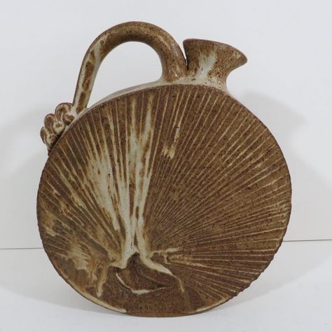 Unique studio pottery rustic stoneware ewer in a flattened disc shape with sharp edges. This vessel has an incised decoration, spout and handle. Finished in shades of tan and brown matte glaze. Unsigned, dated to late 20th century. For decorative use only, not food safe. Ceramic Handbuilding, Coil Pots, Beginner Pottery, Rustic Pottery, Unique Pottery, Pottery Handbuilding, Ceramics Ideas, Rustic Contemporary, Ceramics Ideas Pottery