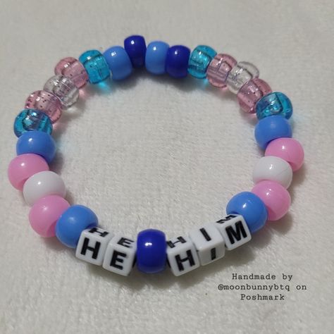 Glittery And Solid Beads In The Trans Flag Colors Pony Bead Pronoun Bracelet "He/Him" With Light Blue And Dark Blue Bead Accents Double Stranded Elastic Kandi Bracelet Perfect For Emo, Scene, Y2k, Rave, Festival, Goth, Pastel Goth, Egirl, Gamer, Lgbt Pride Aesthetics. Elastic Bracelet Has Fair Stretch. Model Wrist 6.5" Model Hand 7.5" Please Check Measurements For Both. Please Do Not Exceed 8" Width, Elastic Will Break More Sizes Will Be Included Soon. Stock And Supplies Are Limited. Original Ha Word Friendship Bracelets, Corpse Husband Bracelet, Trans Kandi Bracelet, Simple Kandi Bracelets, Single Kandi Bracelets Ideas, Blue Kandi Bracelets, Bracelet Patterns Pony Beads, Trans Kandi Cuff, Candy Bead Bracelet Ideas