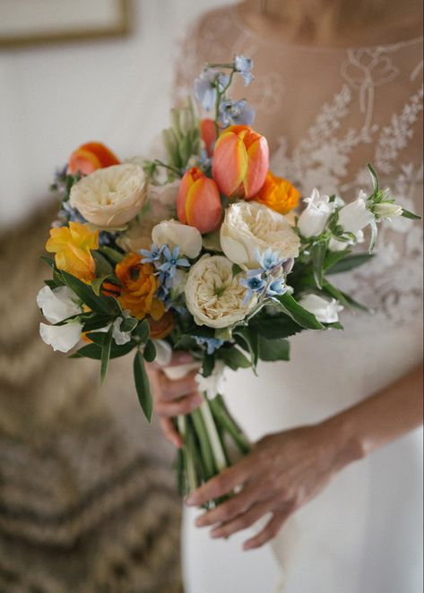 Orange & Blue Bridal Bouquet- Spring 2022 Orange And Blue Wildflower Bouquet, Wedding Bouquet Spring Flowers, Blue Green Orange Bouquet, Blue Orange And Pink Aesthetic, Blue Yellow Pink Wedding Bouquet, Bridal Bouquet With Tulips, May Bridal Bouquets, Orange Blue Wedding Flowers, Blue Orange Bouquet