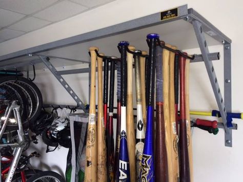 This baseball rack is perfect for storing bats when it isn't time to play ball. Keep your equipment in perfect condition, while keeping it easily accessible. Baseball Gear Storage, Baseball Bat Storage, Bat Storage, Outdoor Gear Storage, Sports Equipment Storage, Garage Transformation, Garage Solutions, Sports Storage, Garage Accessories