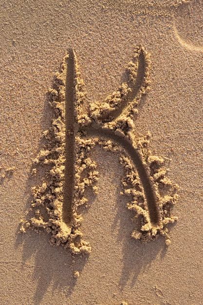 Premium Photo | Alphabet (k) letters handwritten in sand on beach K Letter Images, Letters Handwritten, Letter Fonts, Letter Ideas, Aesthetic Letters, Alphabet Wallpaper, K Wallpaper, Lettering Alphabet Fonts, Design Stand