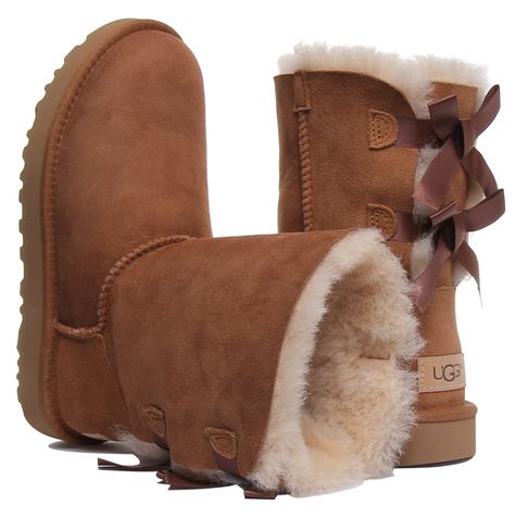 The Ugg has added silky bows to their icon boots for a sweet, feminine take. Crafted with soft sheepskin upper and lining, this versatile boot is pretreated against water and stains, and features their signature lightweight sole for extra cushioning, durability, and traction. Pair with practically anything, from athleisure wear to flowy dresses. Ugg Mini Bailey Bow, Uggs With Bows, Mini Baileys, Ugg Mini, Bailey Bow Uggs, Bailey Bow, Shoe Inspo, Athleisure Wear, Flowy Dress