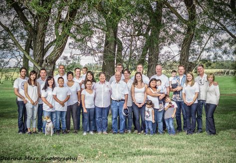 A large extended multi-generational family pose in front of a row of trees in matching white shirts and jeans, Edmonton, by Deanna Marr Photography, Outfit Inspiration Row Of Trees, Family Photography Outfits, Extended Family Photography, Best Landscape Photography, Extended Family Photos, Family Photo Outfits, Extended Family, Clothing Photography, Family Posing