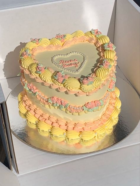 A pearly piped vintage cake in shades of peach and yellowHeart shaped cake with pisces baby written on top Sunflower Heart Cake, Heart Shaped Birthday Cake, Tiny Cake, Heart Birthday Cake, 22nd Birthday Cakes, Cake Yellow, Bolo Vintage, Heart Shaped Cake, Vintage Birthday Cakes