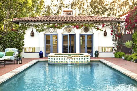 The tiles on a raised Jacuzzi create a focal point at the end of the pool. French doors open to the poolhouse. Colonial Revival House, Boho Glam Home, Spanish Colonial Homes, Spanish Bungalow, 1920s House, Colonial Style Homes, Mediterranean Home Decor, Spanish Style Home, Casas Coloniales