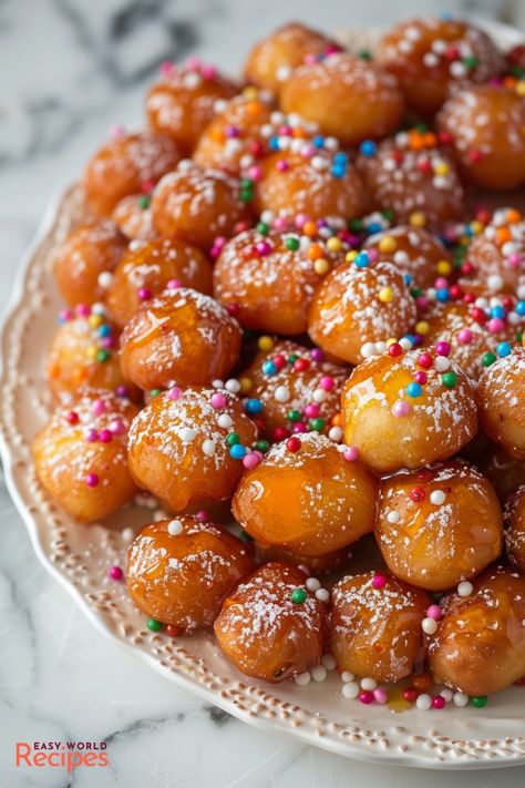 Classic Struffoli is a traditional Christmas dessert from Italy. These light and airy fried dough balls are coated in sweet honey syrup and sprinkles. Italian Struffoli, Italian Christmas Dessert Recipes, Honey Balls Recipe, Pain Au Chocolat Recipe, Fried Dough Balls, Struffoli Recipe, Italian Christmas Desserts, Honey Balls, Authentic Italian Desserts