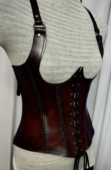 It is handmade leather Under-bust corset with hand-sewn leather detailing. It's adjustable Lace in front side and back side with buckles. We used about 2 to 2.2 mm thick handmade leather. It is hand dyed handmade leather. It is crazy for medieval events and Larp.   Corset is hand made from sturdy top-grain leather.  Bust Size is available  28 Inch to 40 inch DETAILS: ► 100% Handmade ► 100% Genuine leather ► Made on your measurements ► Unique design ► LARP standard ► Worldwide delivery Usually it Leather Corset Armor, Leather Armor Women, Corset Armor, Brown Leather Corset, Diy Goth Clothes, Steampunk Medieval, Armor Ideas, Under Bust Corset, Brown Corset