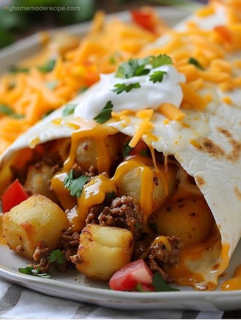 Indulge in the comforting bliss of Cheesy Potato Burritos, where golden potatoes and melting cheese unite for a symphony of flavors. It's a twist on the classic, sure to enchant! Dinner Recipes Burritos, Cheesy Potato Burrito Taco Bells, Ground Beef And Potato Burritos, Cheesy Potato Burritos, Cheesy Potato Burrito, Foods Before Workout, Cheesy Potato Burrito Recipe, Beef And Potato Burrito Recipe, Brisket Burritos