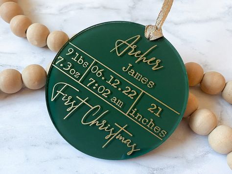 "Baby's First Christmas ornament with customized birth stats is the perfect gift for new parents! This personalized ornament is sure to be one of the most thoughtful and cherished keepsakes they will receive this year. MATERIALS: - Clear acrylic ornament, 4 inch diameter (4 inches tall and wide), 1/8 inch (3 mm) thick - Acrylic paint - Water-based sealant for paint protection - Premium permanent vinyl  - NEW: Chiffon ribbon, 1.5 inches wide (see listing photo for options) HOW TO ORDER: 1. Select Birth Stats Ornament, Cricut First Christmas Ornament, Cricut Christmas Tree Decorations, Flat Acrylic Christmas Ornaments, New Baby Ornament, Acrylic Name Ornaments Diy, Newborn Christmas Ornament, Christmas Ornaments First Christmas, Diy Christmas Ornaments 2024