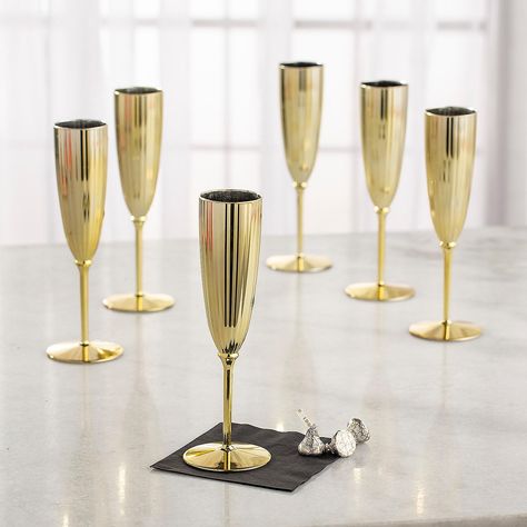 PRICES MAY VARY. Perfect for big events like wedding receptions, fundraisers or milestone anniversary parties, these slim champagne glasses combine elegance with a lovely sheen and the convenience of plastic drinkware. Material: Plastic. (4 dz./unit) Size: 8 1/2" 4 oz. Plastic. (4 dozen per unit) 8-1/2" 4 oz. Perfect for big events like wedding receptions, fundraisers or milestone anniversary parties, these slim champagne glasses combine elegance with a lovely sheen and the convenience of plasti Elegant Housewarming Party Ideas, Champagne Centerpieces, Gold Champagne Glasses, Hollywood Prom, Wedding Drinkware, Jazz Party, Gold Champagne Flutes, Plastic Champagne Flutes, Spa Night