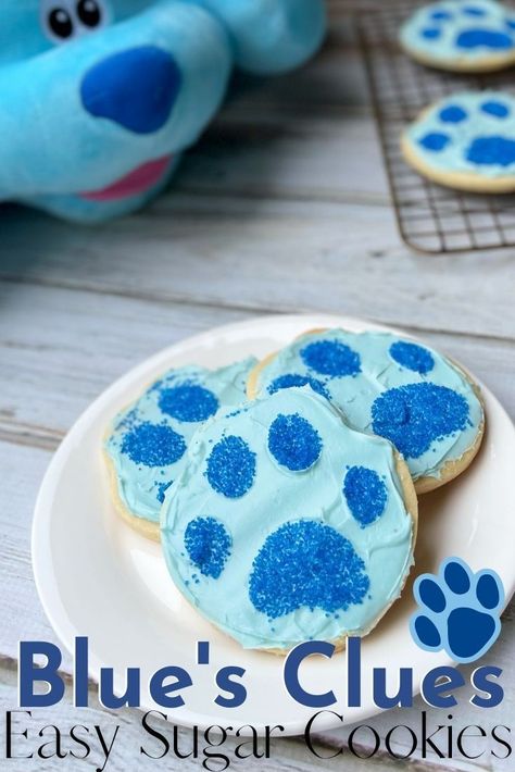 Throw a fun party with these EASY Blue's Clues cookies! They're a sugar cookie base with blue frosting and a sprinkle paw print to decorate. Perfect for a birthday party, snack or movie watching party! Blues Clues Themed Food, Blue Clues Birthday Party Ideas Food, Blues Clues Birthday Party One Year Old, Blues Clues Two Birthday, Blues Clues Third Birthday Party, Blues Clues Food Ideas, Blues Clues Party Games, Blues Clues 2nd Birthday Party Boys, Blues Clues Second Birthday Party