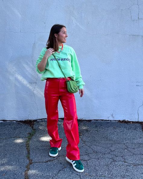 🍉🍒🍓 For a bold, elevated street style outfit that's comfortable and makes a statement, here's a suggestion: 1. Top: Neon green oversized graphic sweatshirt for a vibrant, eye-catching look. 2. Bottom: Faux red leather pants to add texture and a pop of color. 3. Footwear: Chunky sneakers for comfort and to balance the bold colors. 4. Accessories: - Statement sunglasses, perhaps with mirrored or colored lenses. - A crossbody bag in a complimentary color, like light or dark green. - Simple, ... Neon Green And Red Outfit, Elevated Street Style, Red Leather Pants, Statement Sunglasses, Street Style Outfits Men, Complimentary Colors, Outfits Men, Chunky Sneakers, Red Outfit