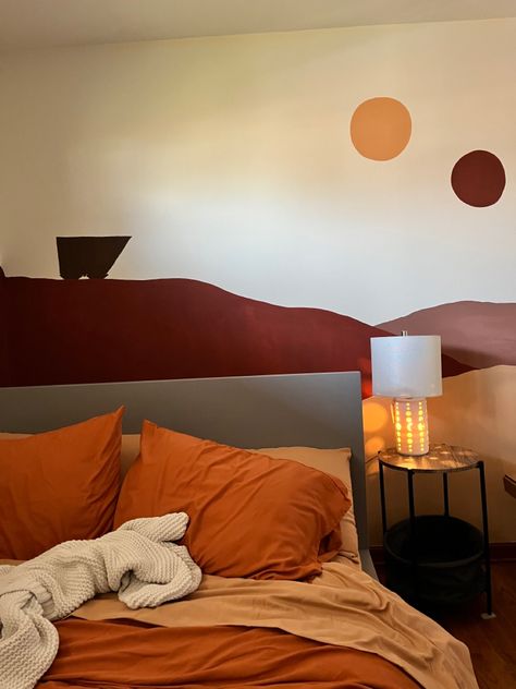 A bedroom that has been painted in oranges and browns and reds to resemble the scene in Star Wars of Tatooine with its 2 suns. The bed has a duvet of matching colors. Tatooine Inspired Bedroom, Star Wars Home Aesthetic, Tatooine Mural, Tatooine Aesthetic Bedroom, Star Wars Mural Bedroom, Tatooine Bedroom, Tatooine House, Tatooine Aesthetic, Star Wars Room Ideas