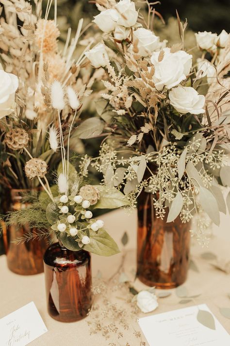 Black Taupe And Greenery Wedding, Boho Neutral Centerpieces, Simple Boho Bridal Shower Centerpieces, Jug Centerpiece Wedding, Boho Fall Bouquet, Norse Wedding Decor, Simple Boho Wedding Centerpieces, Amber Vases Wedding Centerpieces, Fall Wedding Decorations Diy