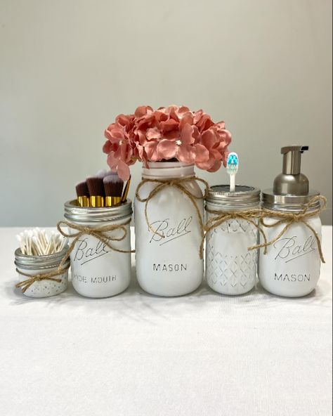 Beautiful farmhouse bathroom! Had painted to order. This set makes a great wedding gift or Christmas gift. 😊 https://www.etsy.com/listing/1825628855/mason-jar-bathroom-decor-white-mason?click_key=e15f9422f6c3433cf8d80f60694d255d64fa0da8%3A1825628855&click_sum=a8efb312&ref=shop_home_active_2 #etsyshop #etsyseller #farmhousedecor #christmasgifts Bathroom Mason Jars, White Mason Jars, Farmhouse Soap Dispenser, Mason Jar Bathroom Decor, Bathroom Decor White, Flower Arrangements Home Decor, Bathroom Dispenser, Bathroom Decor Christmas, Flower Arrangements Home