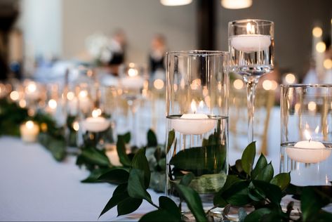 Candles With Water Wedding Ideas, Floating Led Candles Wedding, Candle Centerpieces Wedding Circle Table, Ikea Cylinder Vase Ideas Wedding, Glass Cylinder Vases Decorating Ideas, Glass Cylinder Centerpieces Wedding, Tall Cylinder Vase Centerpiece, Cylinder Vase Centerpiece Wedding, Vases With Floating Candles