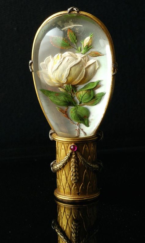 Parasol handle with a reverse intaglio depicting a rose motif. A reverse crystal intaglio is a rock crystal cabochon with an intaglio carved into the flat back 1860-1900 Bijoux Art Nouveau, Canes And Walking Sticks, Cane Handles, Red Carnation, Walking Sticks And Canes, Canes & Walking Sticks, Umbrellas Parasols, Walking Canes, Walking Stick