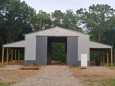 36x36 horse barn with 12ft leans off each side. Leans are extra tall to park the trailer under and the barn is tall enough for a hay loft to be added eventually. For a full barn tour go here-> https://youtu.be/AIdflm3X6cA Pole Barn Hay Storage, Shop With Lean To On Both Sides, Pole Barns With Lean To, Barn With Lean To, Hay Barn Ideas, Barn Shop Ideas, Barn Dominium, Tractor Barn, Pole Barn Garage