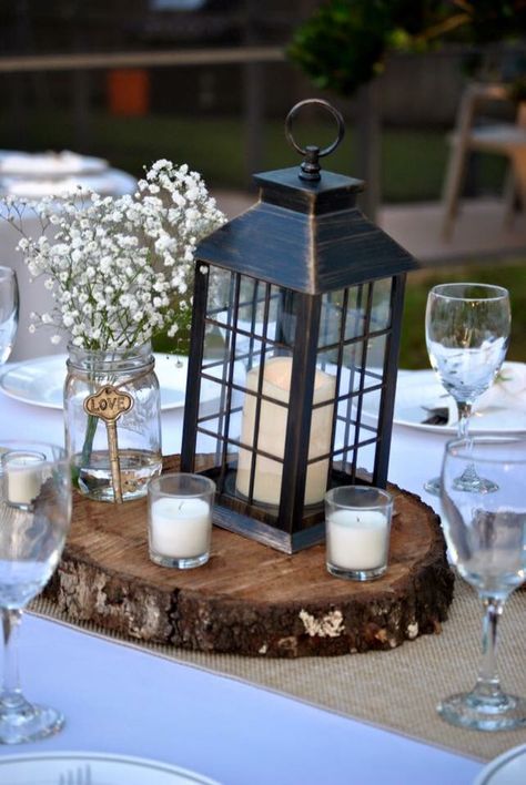 Lantern And Mason Jar Centerpieces, Center Piece With Lanterns, Compass Centerpiece Ideas, Wedding Table Decorations With Lanterns, Irish Centerpieces, Clock Centerpieces, Simple Lantern Centerpieces, Black Lantern Centerpiece, Irish Wedding Decorations