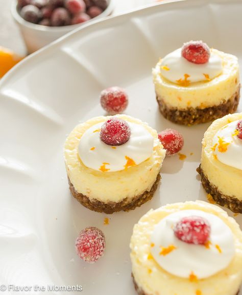 Mini Cranberry Orange Cheesecakes are creamy bite-sized cheesecakes bursting with holiday flavor! {GF} @FlavortheMoment Mini Orange Cheesecake, Christmas Mini Cheesecakes, Cranberry Orange Cheesecake, Cute Thanksgiving Desserts, Orange Cheesecake Recipes, Holiday Cheesecake, Orange Cheesecake, Dessert Cheesecake, Cranberry Cheesecake