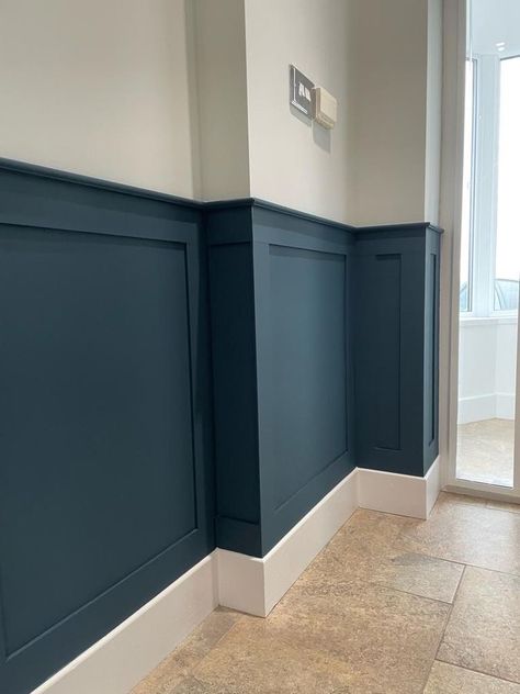 Colourful Wainscoting, Blue Waynes Coating Ideas, Wainscoting Two Tone, Dark Teal Board And Batten, Navy Wainscoting Hallway, Half Paneled Walls Hallway, Living Room Half Wall Paneling, Blue And White Wall Panelling, Navy Panelling Hallway