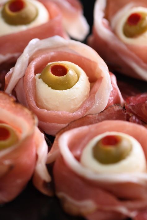 Olive Stuffed Eyeballs, Halloween Cocktail Party Appetizers, Halloween Mozzarella Eye Balls, Stuffed Eyeballs, Prosciutto Eyeballs, Deviled Egg Eyeballs, Scary Halloween Appetizer Ideas, Halloween Eyeball Food, Halloween Party Recipes Appetizers