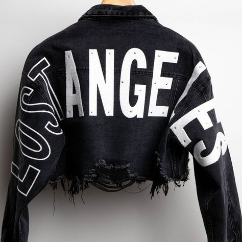 Cropped Distressed Denim Jacket Features Wide Back Patches With The Letters Wording "Lost Angeles" (Light Rhinestone On Letters) Distress Hemline, Long Sleeves, Collar, Front Button Down And Chest Pockets. (Please Note That All Of Our Products Are Hand Made And Include Hand Work So Depending On The Number Of Units Your Order Might Take 1-2 Days To Complete You Will Receive An Email Or Call For Completed Order) 78% Cotton 15% Rayon 7% Polyester Made In China Denim Jacket Personalized, Crust Jacket, Denim Jacket Black, Crop Denim Jacket, Crystal Makeup, Embroidered Jean Jacket, Loft Ideas, Metallic Jeans, Oversized Jean Jacket