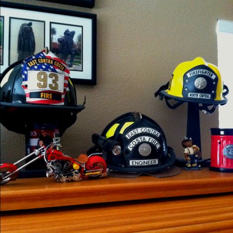 Firefighter helmet display.. Why keep them in boxes show them Off!! How To Display Fire Helmets, Firefighter Helmet Display, Fire Helmet Display, Firefighter Life, Helmet Display, Kid Costumes, Galaxy Wolf, Firefighter Gear, Firefighter Decor