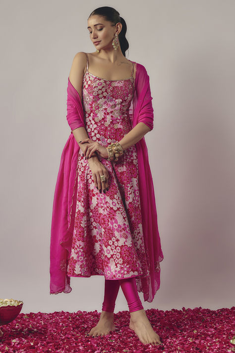 Featuring a pink anarkali in crepe base with floral print and embroidery. It is paired with lycra leggings and a silk organza embroidered dupatta. Accentuate it with statement jewellery and heels for festive occasions.The Party Isnt Over Yet End Of Season Sale Up TO 80%Off On Your Favourite Deals thatre still up for grabs. #Perniaspopupshop #womenswear #ethnic #whatiworewastrending #ppuslove #anarkaliset #lycra #silk #crepe #organza #weddingwear #festivewear Trendy Suits Design, Dresses Out Of Sarees, Casual Floral Dress Outfit, Trending 2024 Fashion, Floral Lehngas, Pink Ethnic Outfits, Indian Outfit For Wedding, Casual Ethnic Outfits, Anarkali From Saree