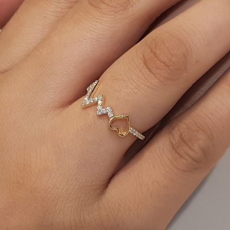 Beautiful Heartbeat Ring with 14k Real Gold Diamond .....The most trendy jewelry love, one ring at a time. stunning jewelry For special one!❤️ DM and Follow more information @rasjewels09 Hurry up @rasjewels09 #realgold #14kgold #healingjewellery #Birthdaygift #explorepage #exploremore #followmore #instagram #heartbeatring #mothersday #jewellerydesign #handmadejewelry #jewelsforwomen #rasjewels #naturalring #diamondrings #explorer #viralpost #featured #usjewellery #ukjewellery #indianjew... Heartbeat Rings, Heartbeat Ring, Heart Beat Ring, Bridal Jewelery, Nature Ring, Special One, One Ring, Stunning Jewellery, Girls Jewelry