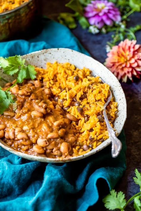 Mom's authentic Puerto Rican Rice and Beans with savory homemade sofrito and sazon! You'll love this incredibly flavorful, comforting homemade meal that will fill your home with unbelievably delicious smells. The perfect recipe to serve a crowd or just savor leftovers for a few days! Puerto Rican Rice And Beans, Homemade Sofrito, Puerto Rican Rice, Protein Vegetarian, High Protein Vegetarian Recipes, Ambitious Kitchen, Rice And Beans, Beans And Rice, Vegetarian Meals