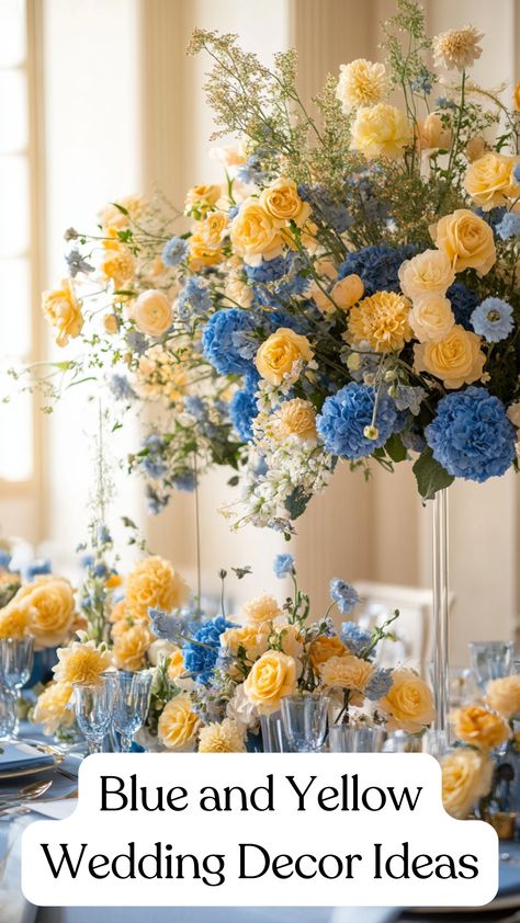 Elegant blue and yellow wedding decor featuring floral arrangements and table settings, creating a bright and stylish atmosphere for a memorable celebration. Light Blue And Yellow Wedding Cake, Yellow Spring Wedding Theme, Dusty Blue And Pale Yellow Wedding Theme, Blue And Yellow Tablescapes, Light Blue And Yellow Wedding Theme, Dusty Blue And Yellow Wedding Theme, Blue And Yellow Flower Arrangements, Yellow And Blue Wedding Theme, Dusty Blue And Yellow Wedding