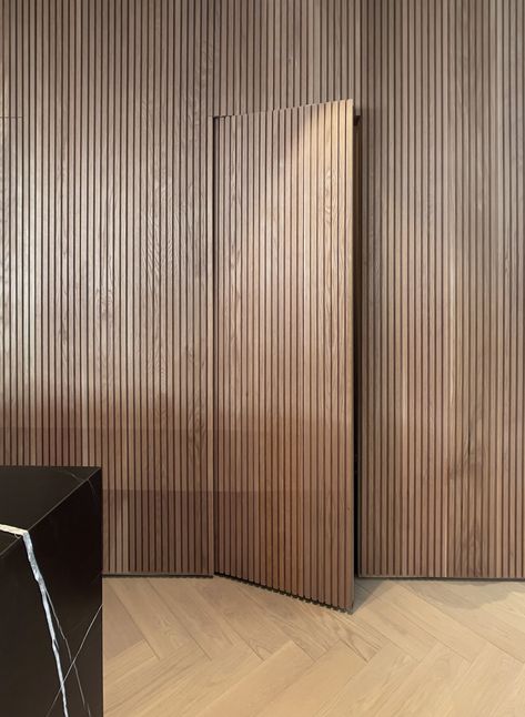 Wall Panel With Concealed Door, Door Concealed In Panelling, Slatted Wood Wall Interior, Wood Slate Door, Timber Panelling Wall Interiors, Japandi Wood Slat Wall, Seamless Door Design, Slatwall Hidden Door, Wooden Slat Wall Hallway