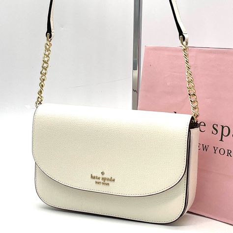 Brand New With Tag Kate Spade New York Kristi Crossbody Bag Product Details Measurements 8" W X 5.1" H X 1.2" D Color: Meringue Features Metal Pinmount With Spade Logo Closure Type: Flap With Magnetic Snap Closure Dust Bag Included: No Interior: 6 Credit Card Slots Exterior: Front Slip Pocket Materials Refined Grain Leather Lining: Two Way Spade Jacquard Lining Imported Style Number Ka698 Kate Spade Bag Aesthetic, Spade Logo, Kate Spade Crossbody Purse, Large Crossbody Bags, Pink Crossbody Bag, Leather Camera Bag, Black Crossbody Purse, Blue Handbags, Kate Spade Bag Crossbody