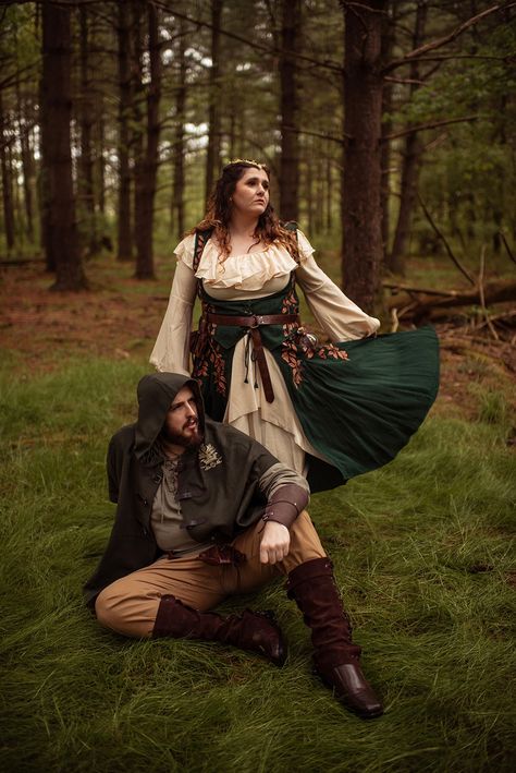 A couple is dressed in fantasy inspired outfits as they walk through the woods for a fantasy themed engagement shoot. Mythical Couples Costumes, Ren Faire Photoshoot, Ren Fair Plus Size, Fantasy Couples Costumes, Ren Fair Wedding, Ren Fair Outfit Ideas, Fair Outfit Ideas, Labyrinth Masquerade, Outfit Ideas Couples