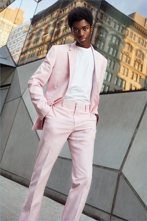 Model Alton Mason dons a pink suit from Express' latest lineup. Men Pink Suit Outfit, Man In Pink Suit, Suit Pink Men, Pastel Pink Suit Mens, Monochrome Suits Men, Men’s Pink Suit, Pink Mens Outfit, Pink Formal Outfit Men, Pink Prom Suits For Men