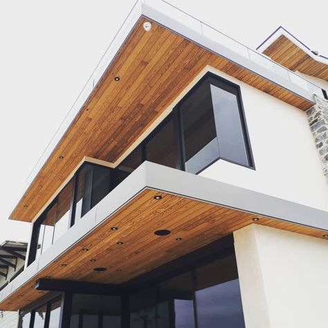 Wood Eaves Exterior, Wood Soffit Exterior Modern, Wood Soffit Exterior, Wood Soffit, Beach Front Home, Rooftop Patio Design, Island Cottage, Simple Ceiling Design, White Exterior Houses