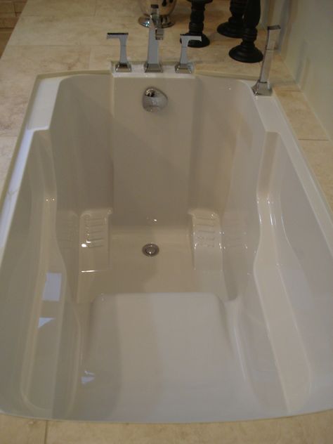 An undermounted Nirvana Japanese-style Deep Soaking Tub Japanese Tub, Tubs Ideas, Deep Soaker Tub, Bathtubs For Small Bathrooms, Bathtub Shelf, Deep Bathtub, Bathtub Shower Combo, Deep Tub, Tub Remodel