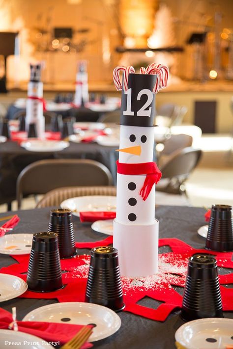 SNOWMAN TABLESCAPE Centerpieces Ideas - Have a super cool DIY Christmas this year with this table full of snowmen. Easy and simple to make snowman theme with can and household items.Craft your own fun decorations. Add a black tablecloth for a striking look. Red and white. by Press Print Party! #christmasdecor #christmas #christmastable #christmasdecorations #christmastablescapes #christmastabledecorations #snowman #snowmancrafts #tablesettings #tablescapes #christmascraft #christmascenterpieces Snowman Tablescape, Christmas Party Centerpieces, Make Snowman, Christmas Party Table Decorations, Diy Snowman Decorations, Snowman Theme, Holidays Decorations, Black Party Decorations, Ward Christmas Party