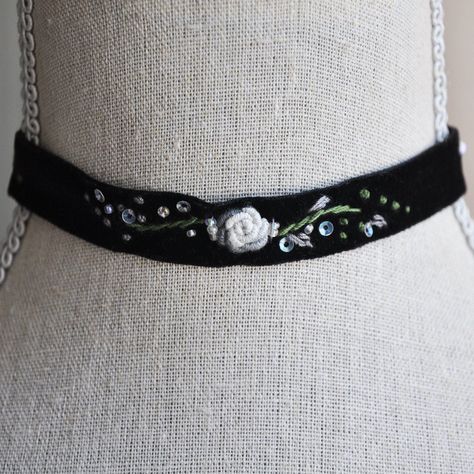 "Vintage Choker // Flower Choker // Black Velvet Choker // Black Flower Choker // Floral Necklace // Boho Jewelry This beautiful blossoming black velvet choker is created with vintage ribbon for an upcycled free-spirited modern look. The flower choker is created with hand embroidered floral motifs, glass beads and embellished with tiny colorful sequins for a pop of sparkle. The clamps on each side are gold plated brass and hold the ends of the velvet in place. The vintage flower choker comes wit Velvet Choker Aesthetic, Vintage Jewelry Aesthetic, Embroidered Choker, Whimsigoth Jewelry, Aesthetic Choker, Choker Ideas, Floral Goth, Choker Outfit, Fabric Choker